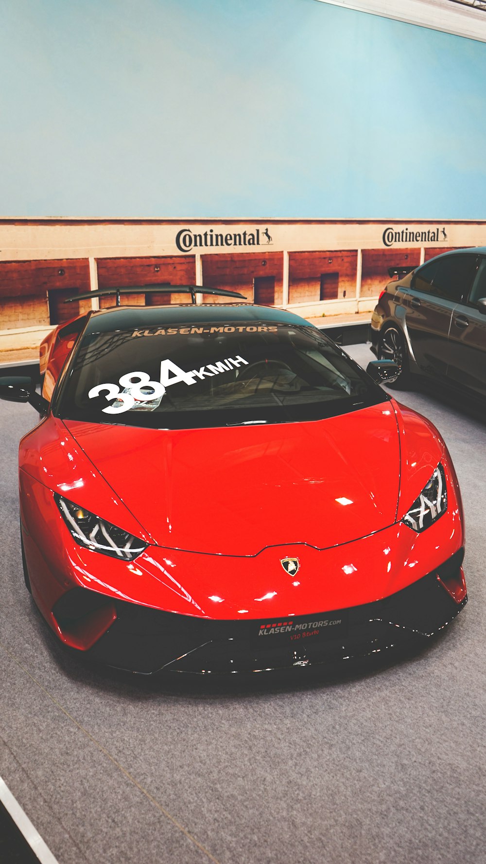 a red sports car parked in a parking lot