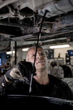 a man working on a car in a garage