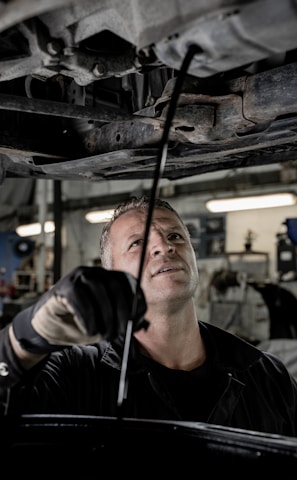 a man working on a car in a garage