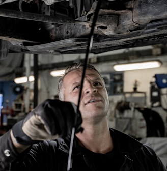 a man working on a car in a garage