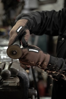 a man working on a piece of metal
