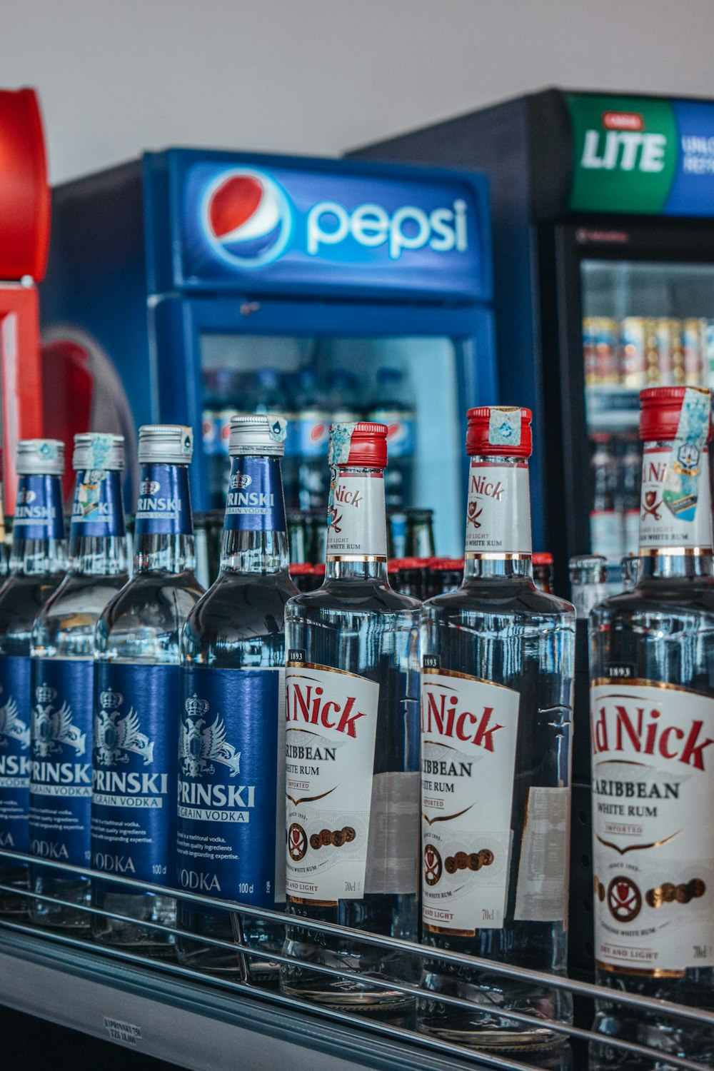 a display case filled with lots of bottles of liquor