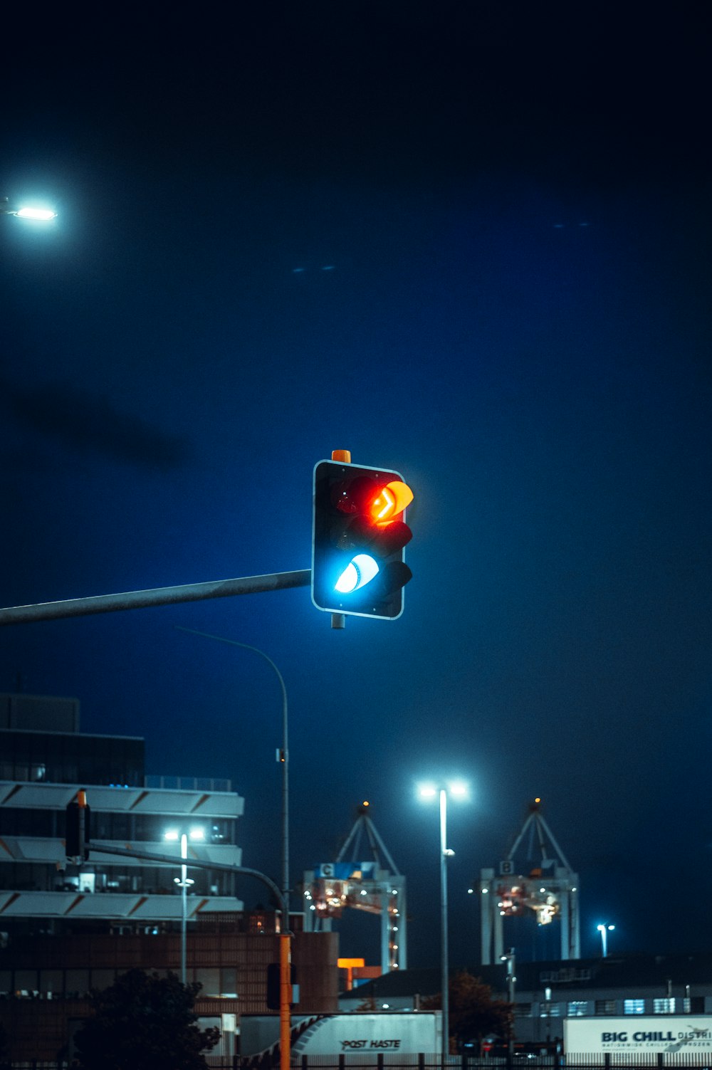 a traffic light on a street at night