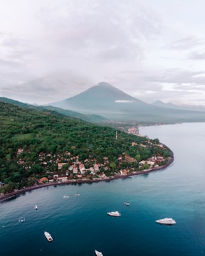 a group of boats floating on top of a body of water