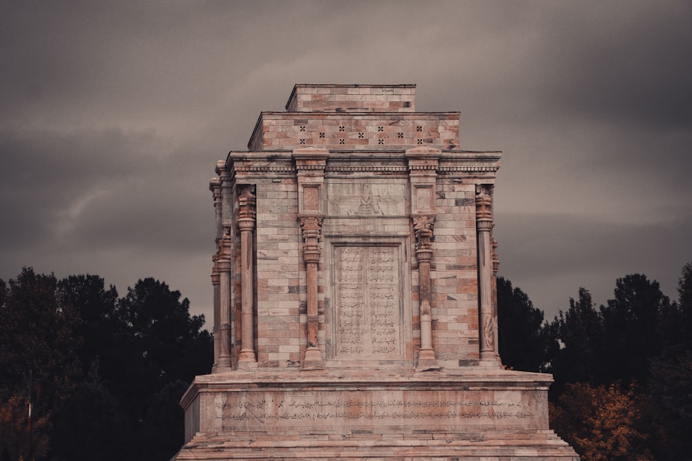 a tall monument with a clock on top of it