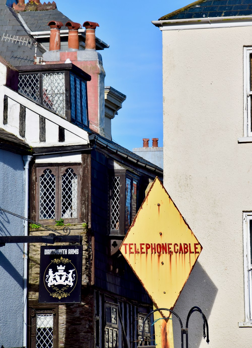 a telephone cable sign in front of a building