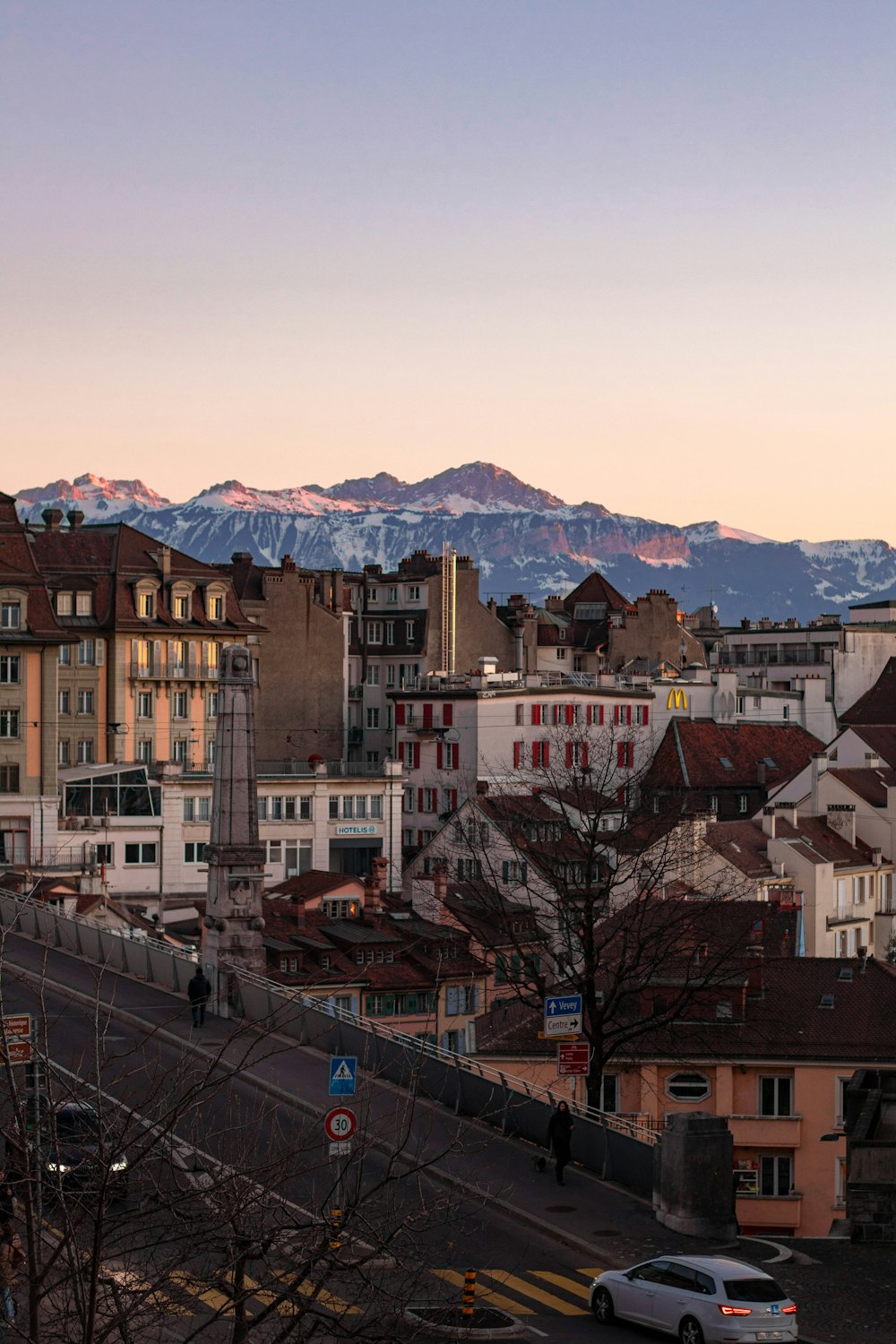 a view of a city with mountains in the background