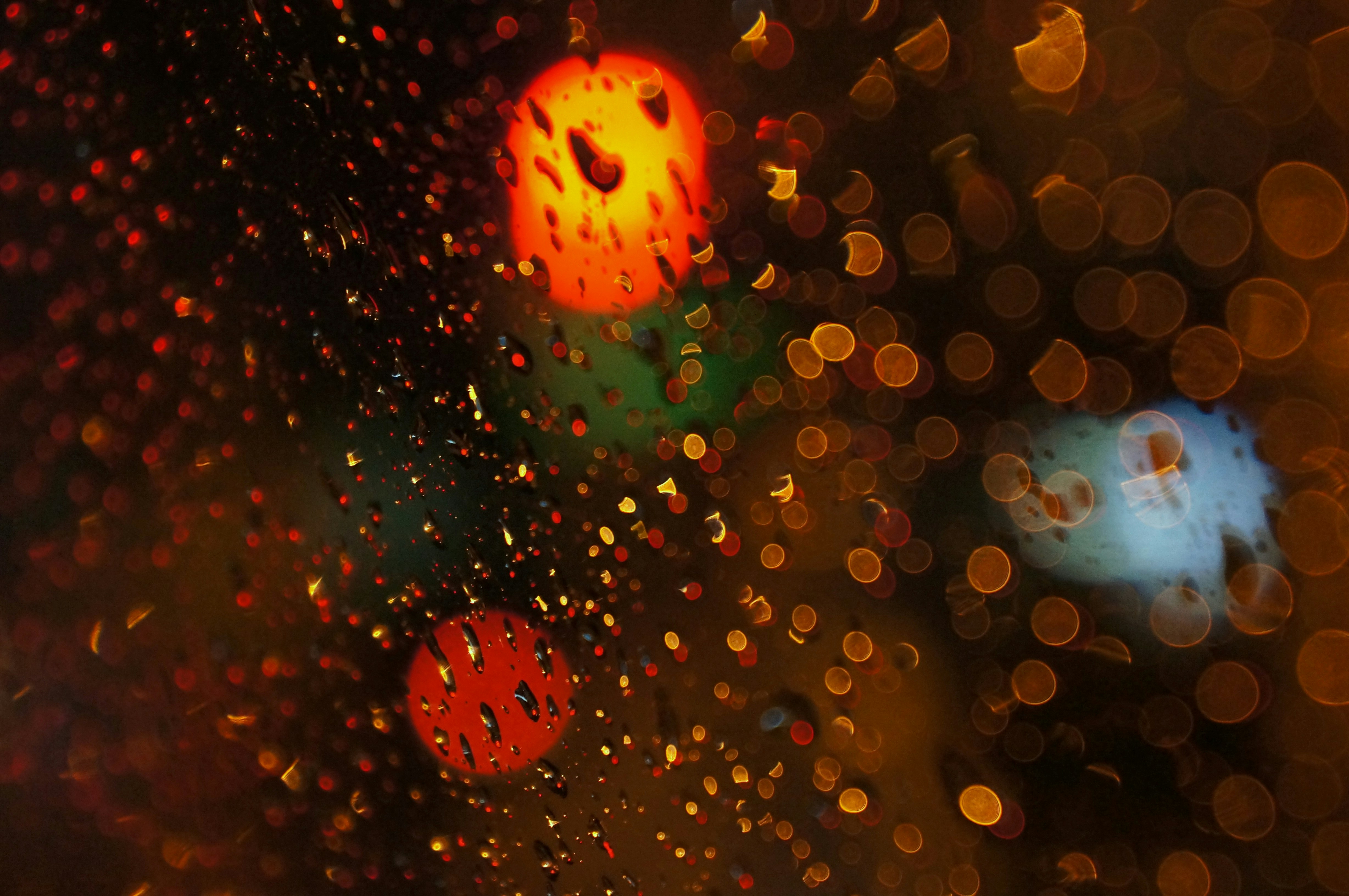 a close up of a traffic light on a rainy day