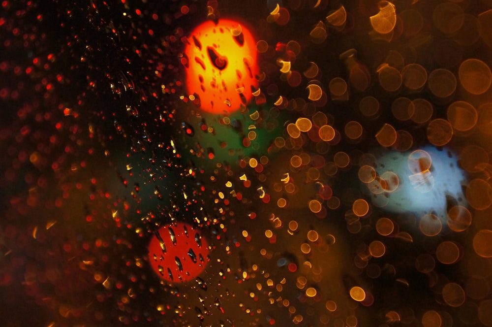 a close up of a traffic light on a rainy day