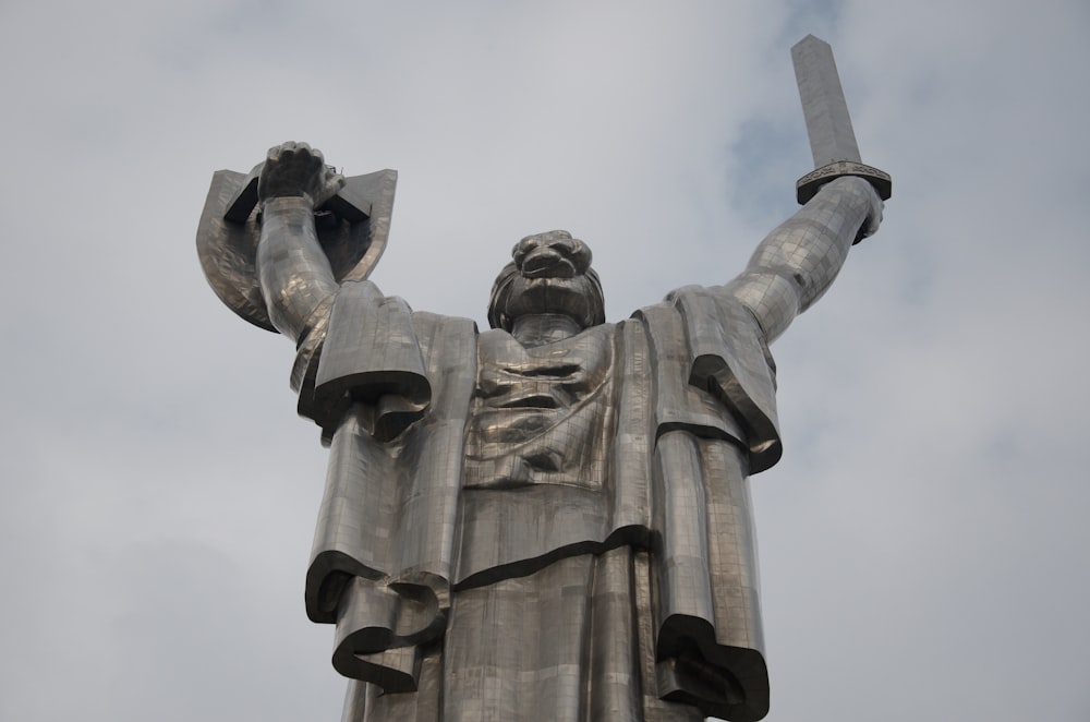 a statue of a man holding a sword