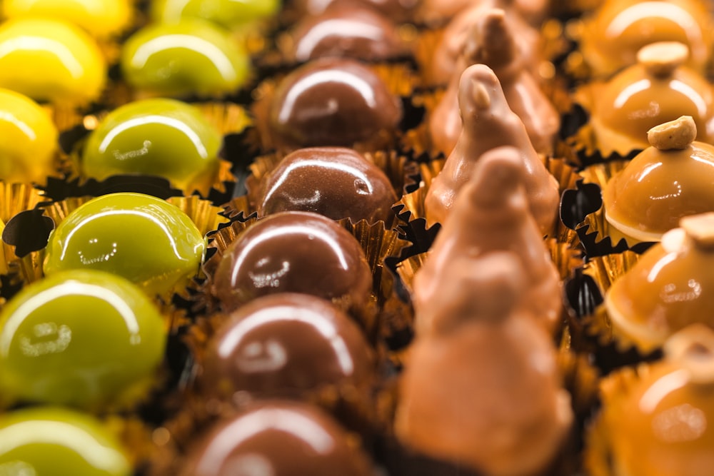 a close up of many different colored candies