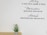 Inspirational text is displayed on the wall, featuring phrases about ability, motivation, and attitude. Below the quotes, a small plant with purple flowers is placed on a wooden surface.
