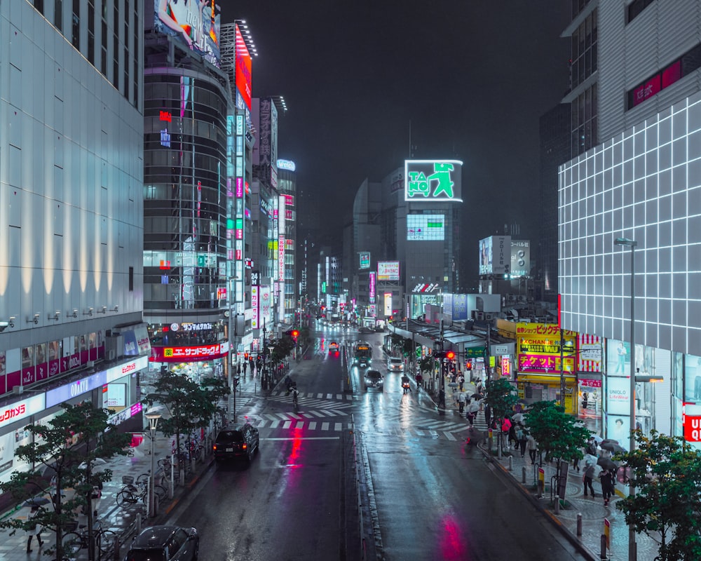 a city street at night with a lot of traffic