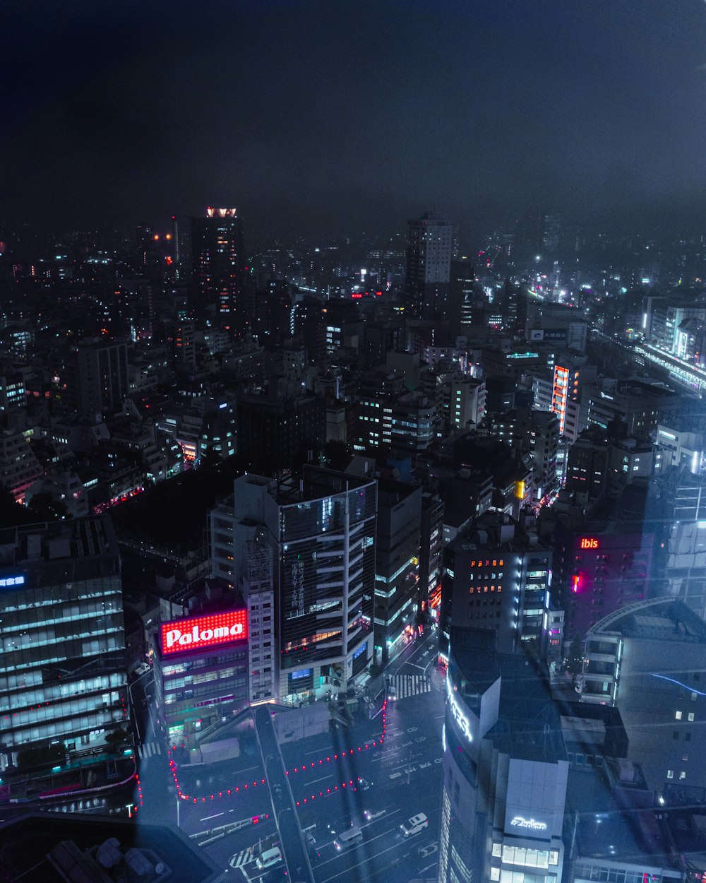 a view of a city at night from a tall building