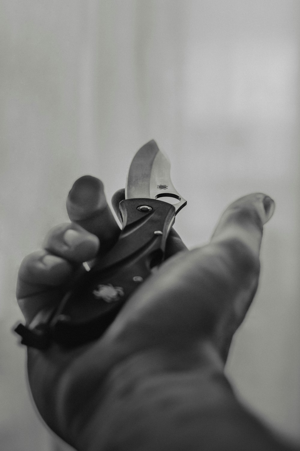a person holding a pair of scissors in their hand