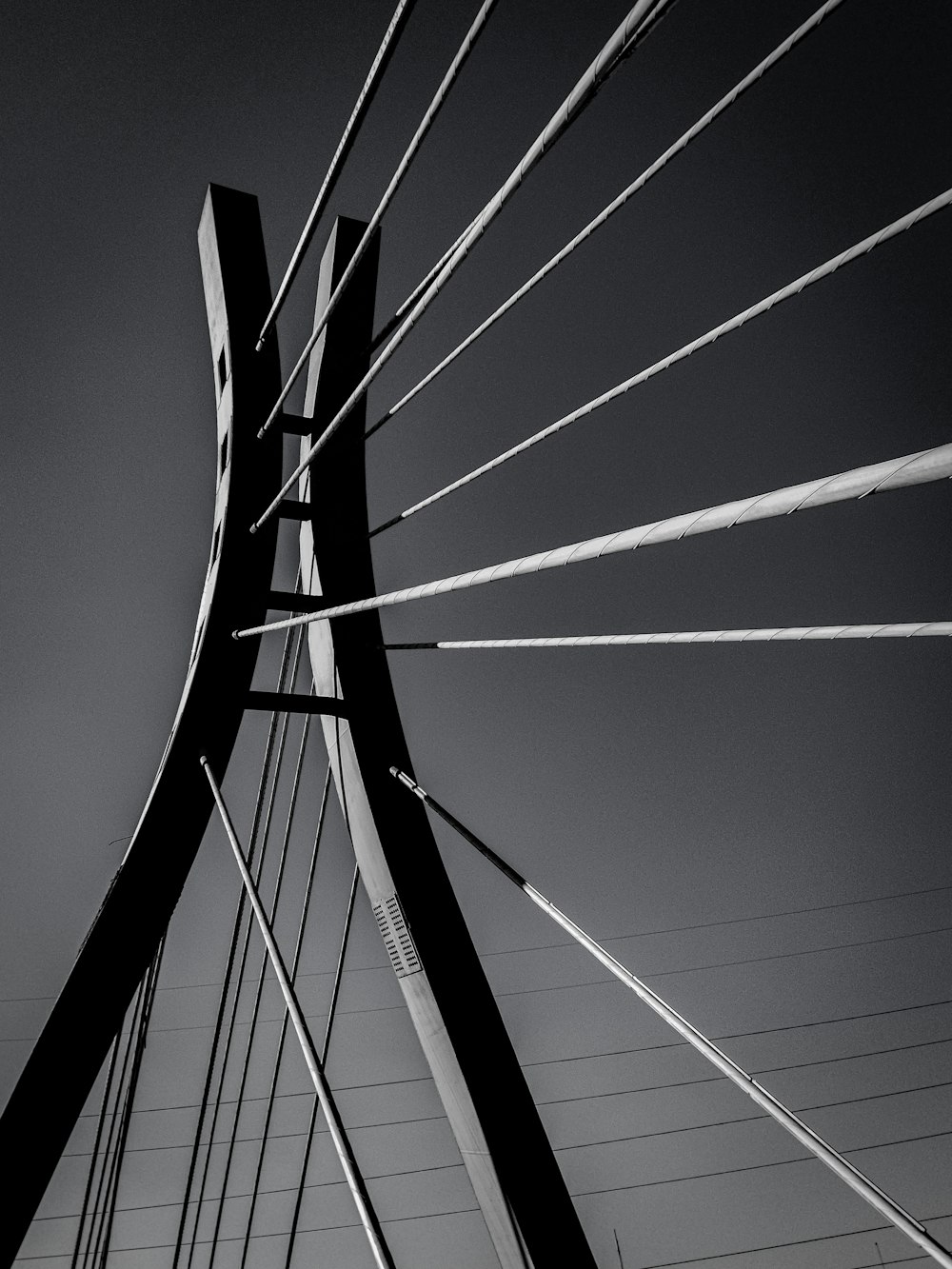 a black and white photo of the top of a bridge