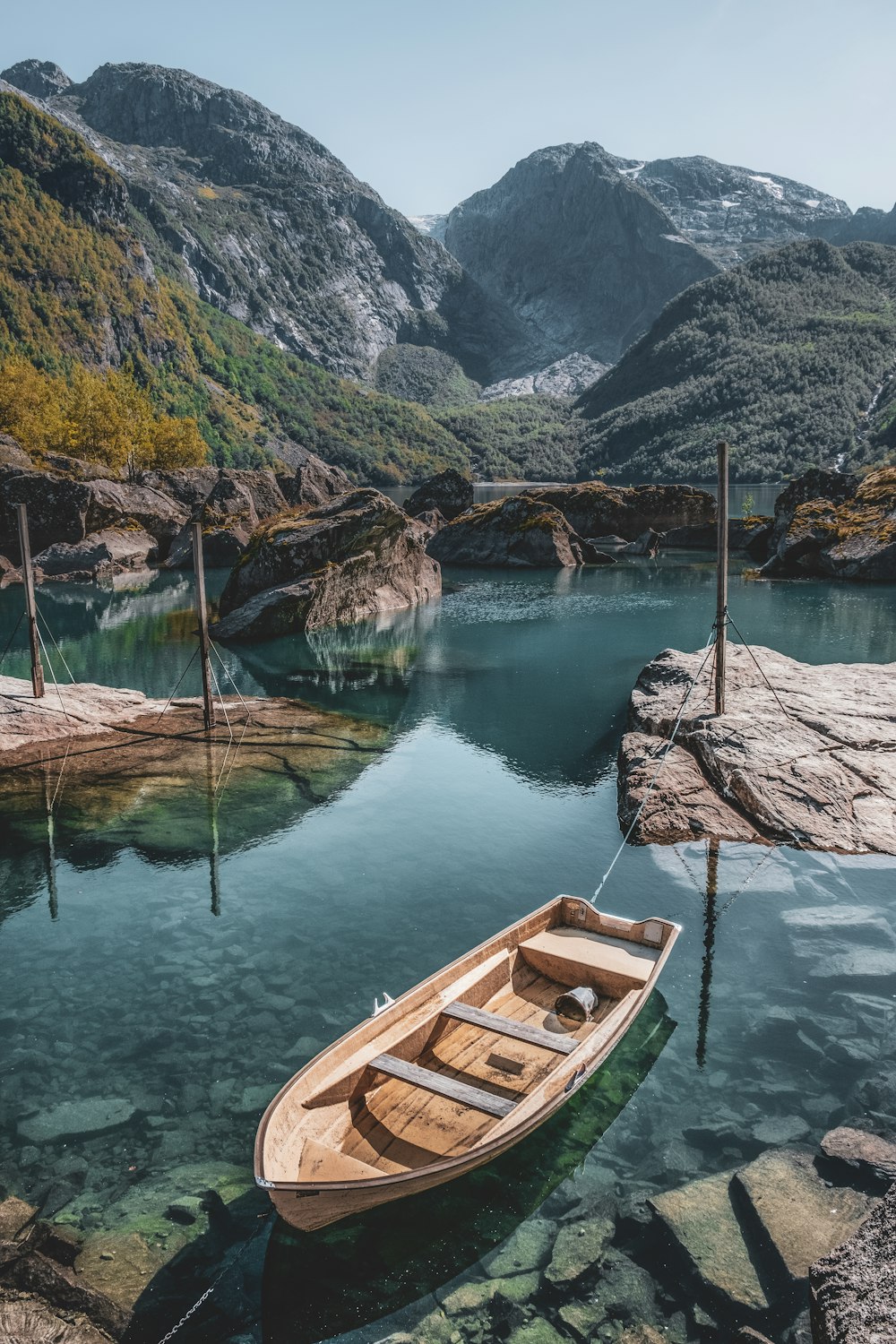 a small boat tied to a dock in the water