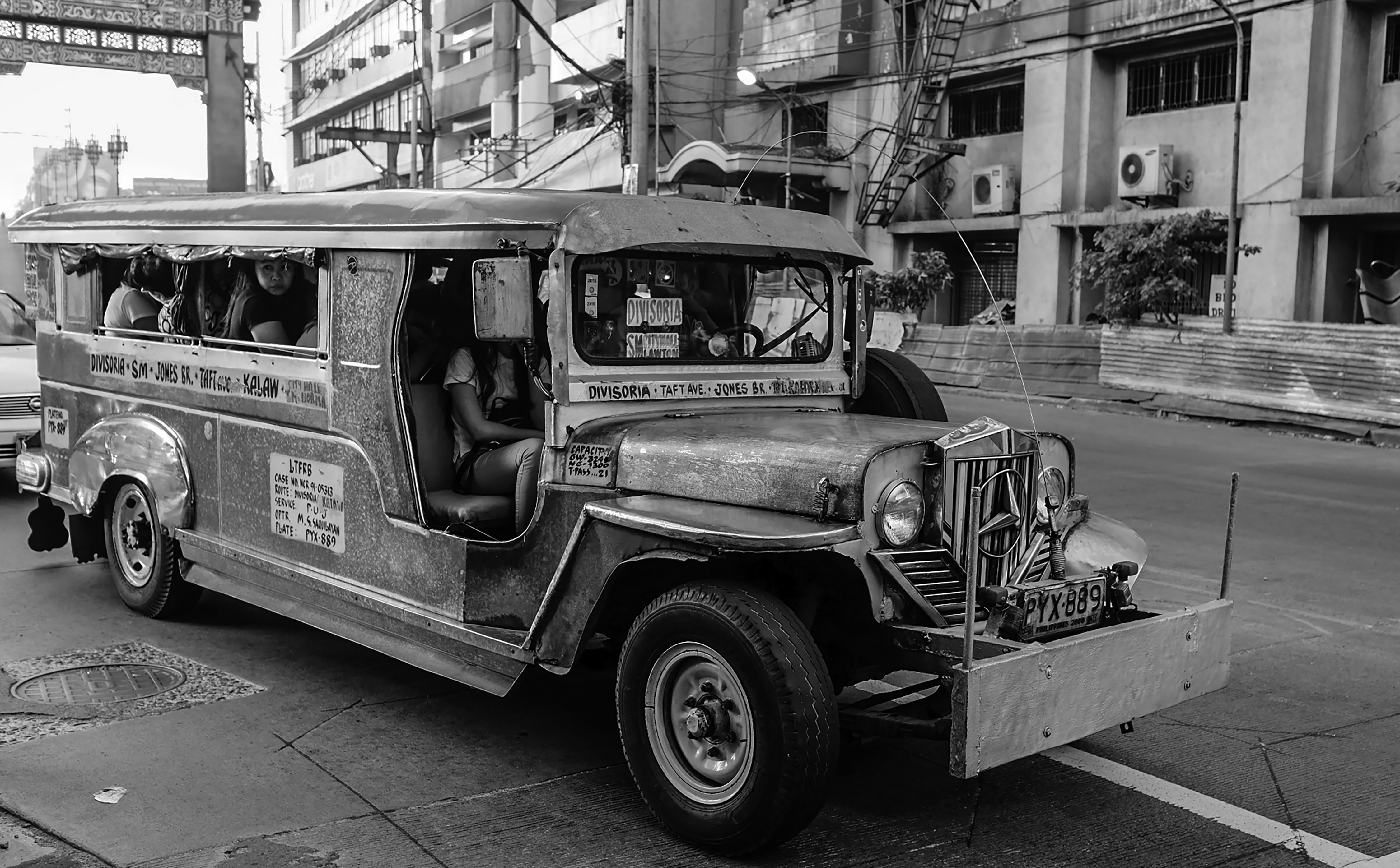 a black and white photo of an old bus, Biyaheng Divisoria [Jeepney ride to Divisoria]