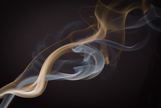 the smoke is white and brown on the black background