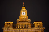 Fairmont Clock Tower hotel exterior illuminated at night with the holy city backdrop.