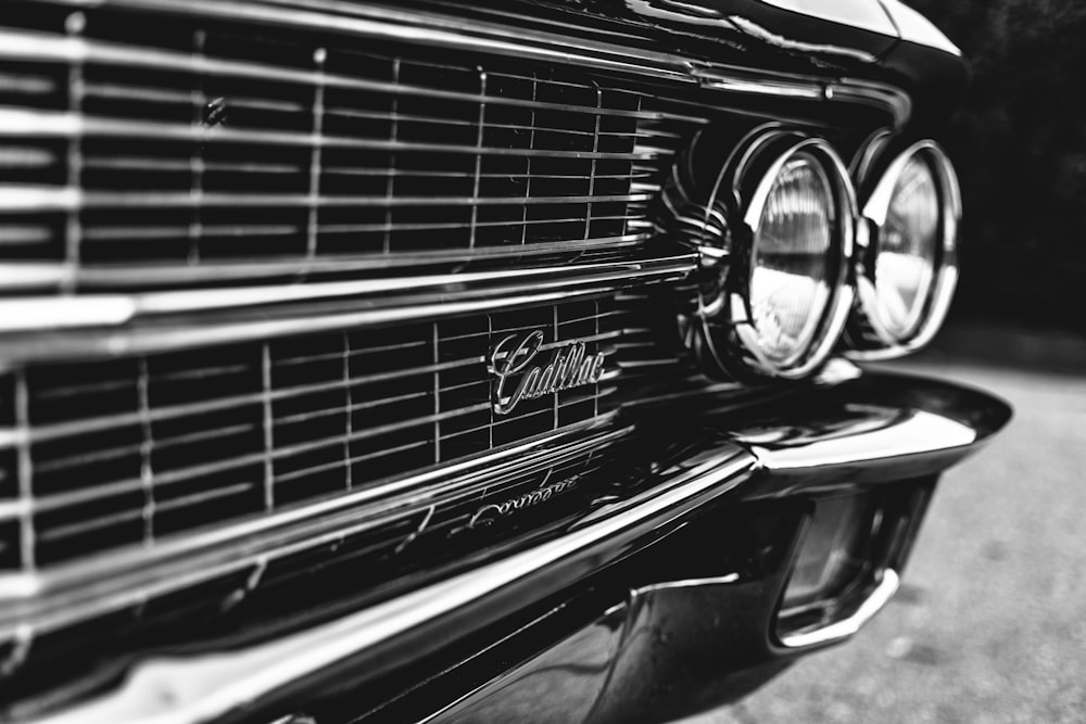 a black and white photo of a classic car