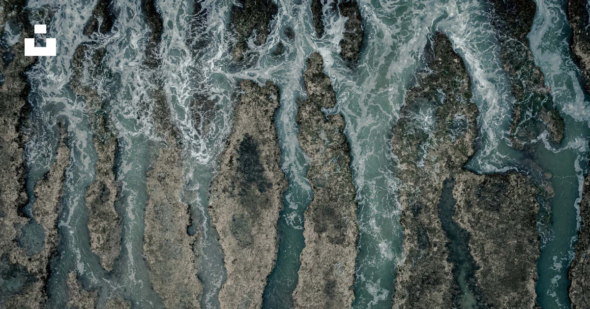 Water Over View An aerial view of a body of water photo – Free Overhead view Image on ...