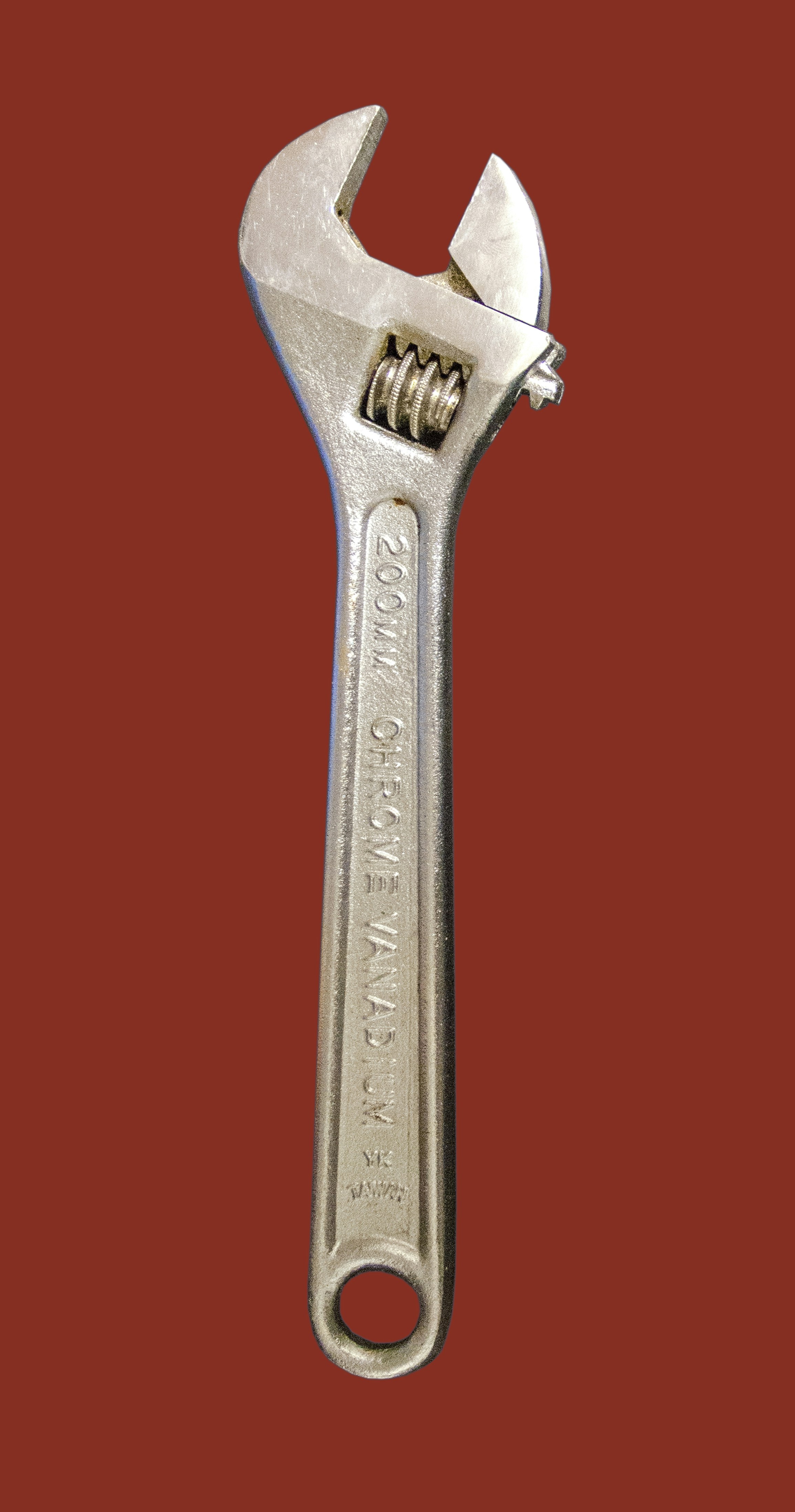 a wrench on a red background with a red background