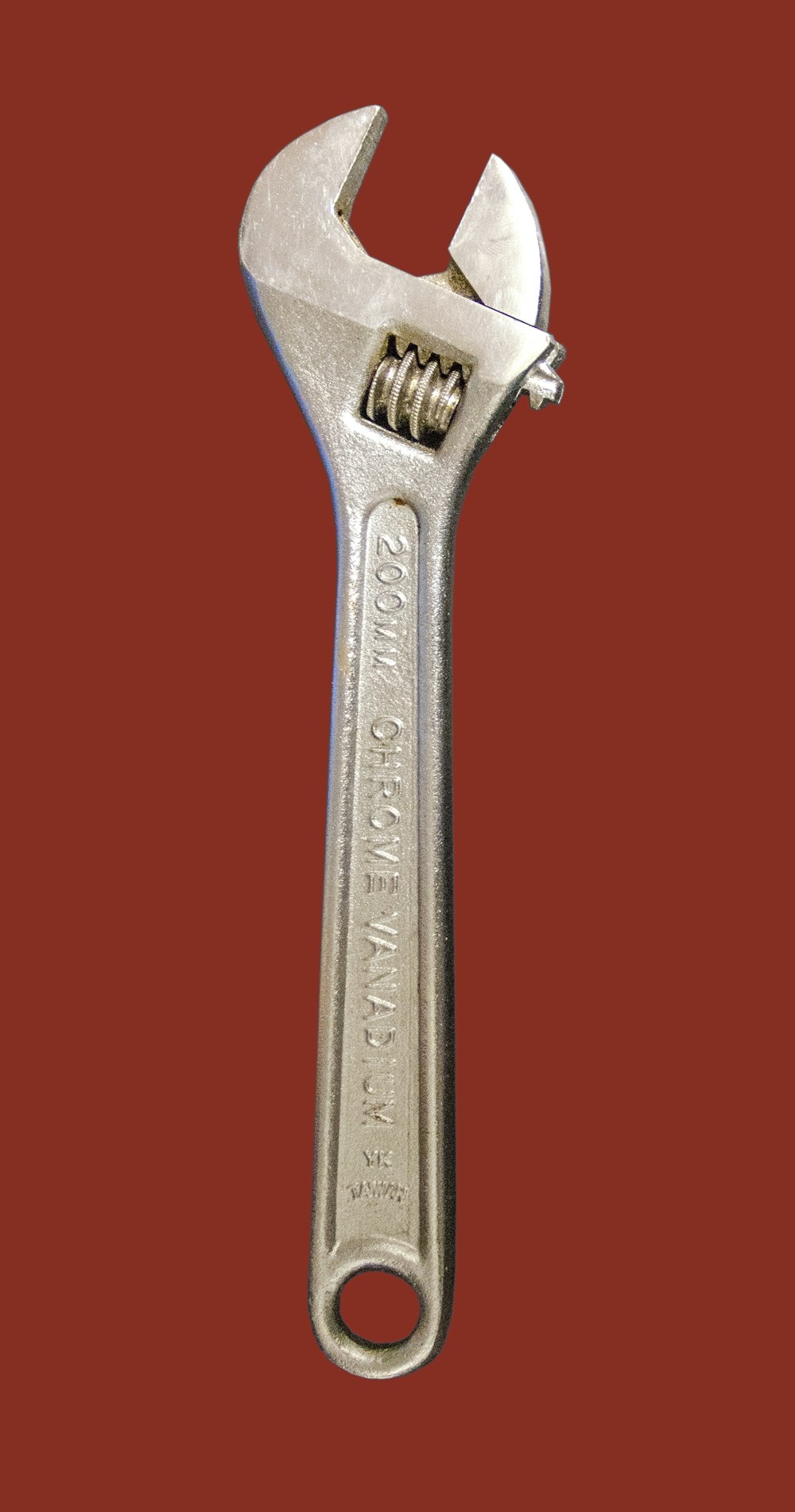 a wrench on a red background with a red background