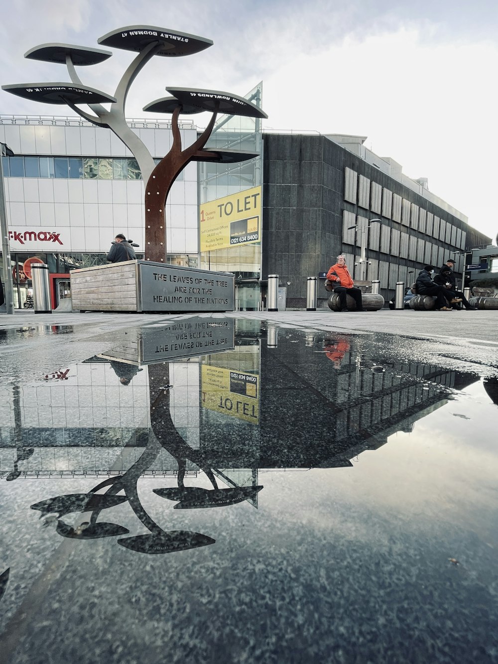 a building with a tree in the middle of it