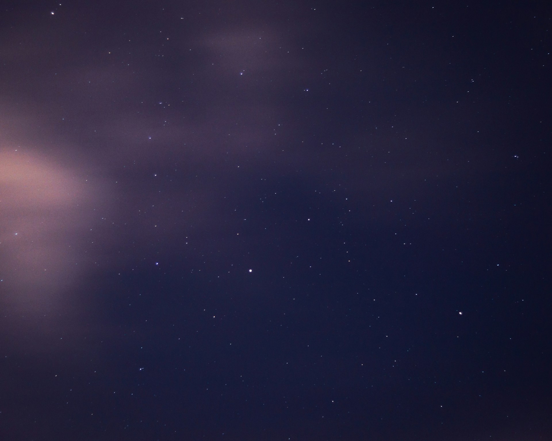 a night sky with stars and clouds