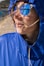 a woman wearing sunglasses and a blue jacket