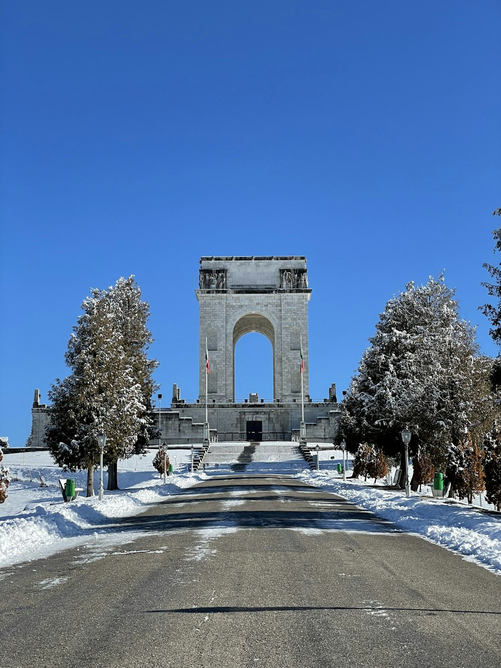 a large monument in the middle of a snowy park