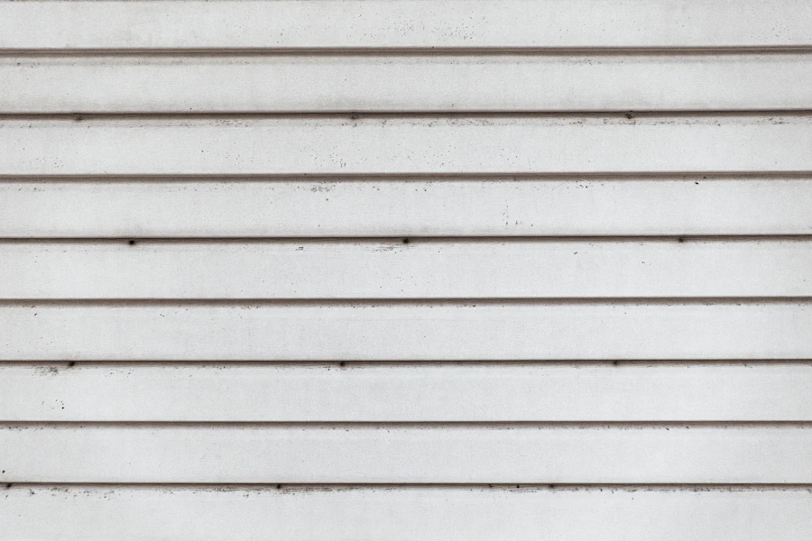 Contemporary facade re-clad in smooth fiber-cement panels with dark accents