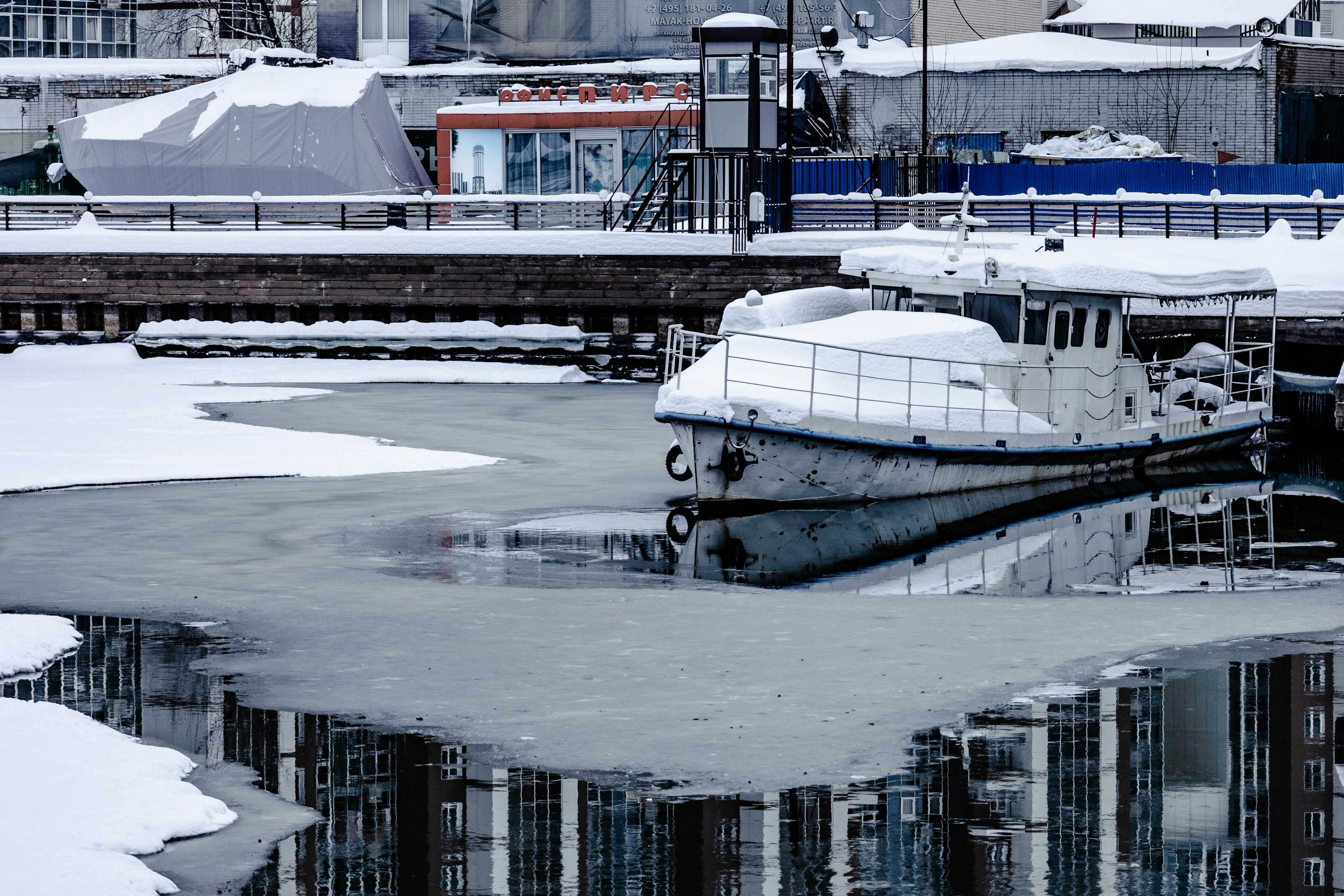 a boat that is sitting on some ice