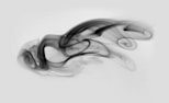 a black and white photo of smoke on a white background