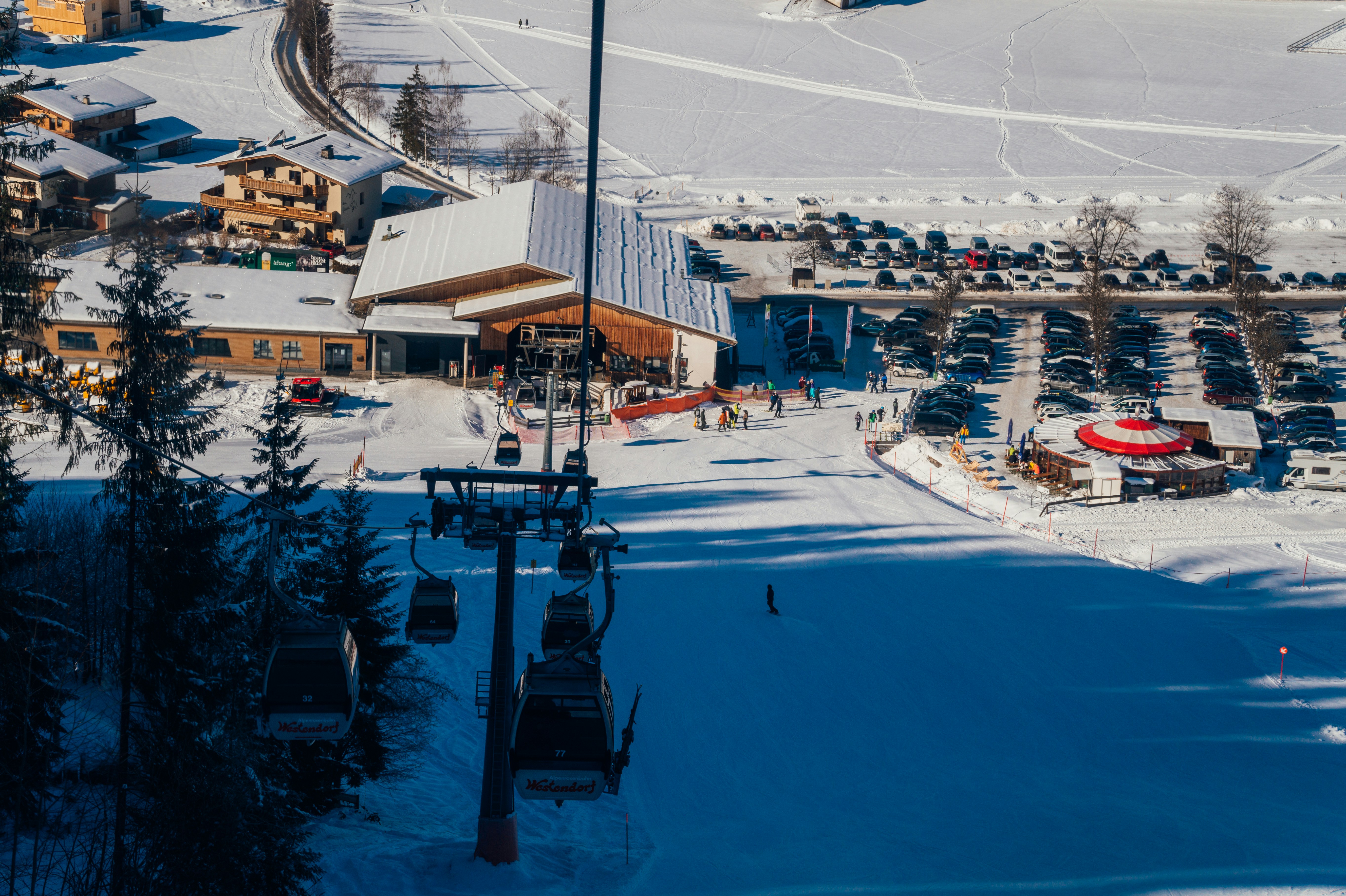 a ski resort with a ski lift in the foreground