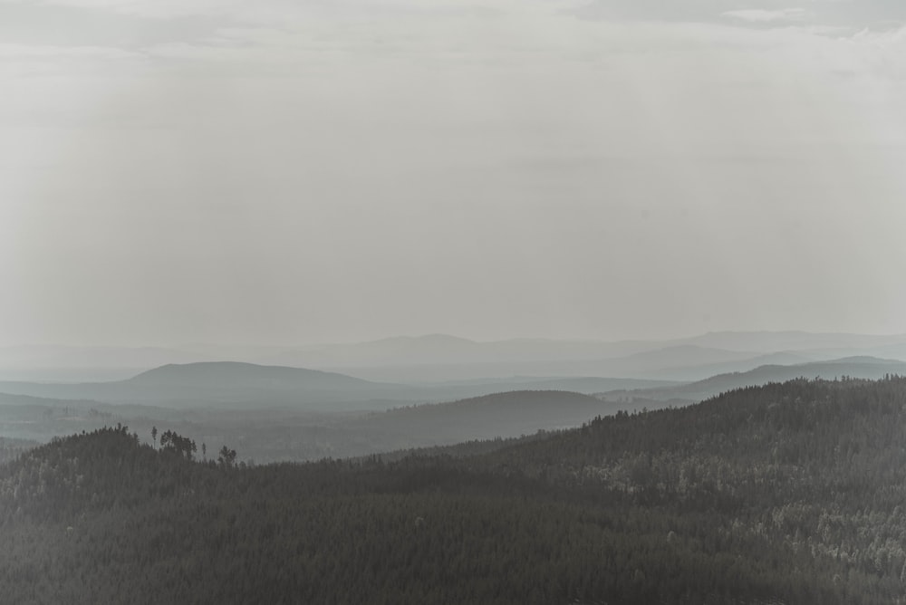 a black and white photo of a mountain range