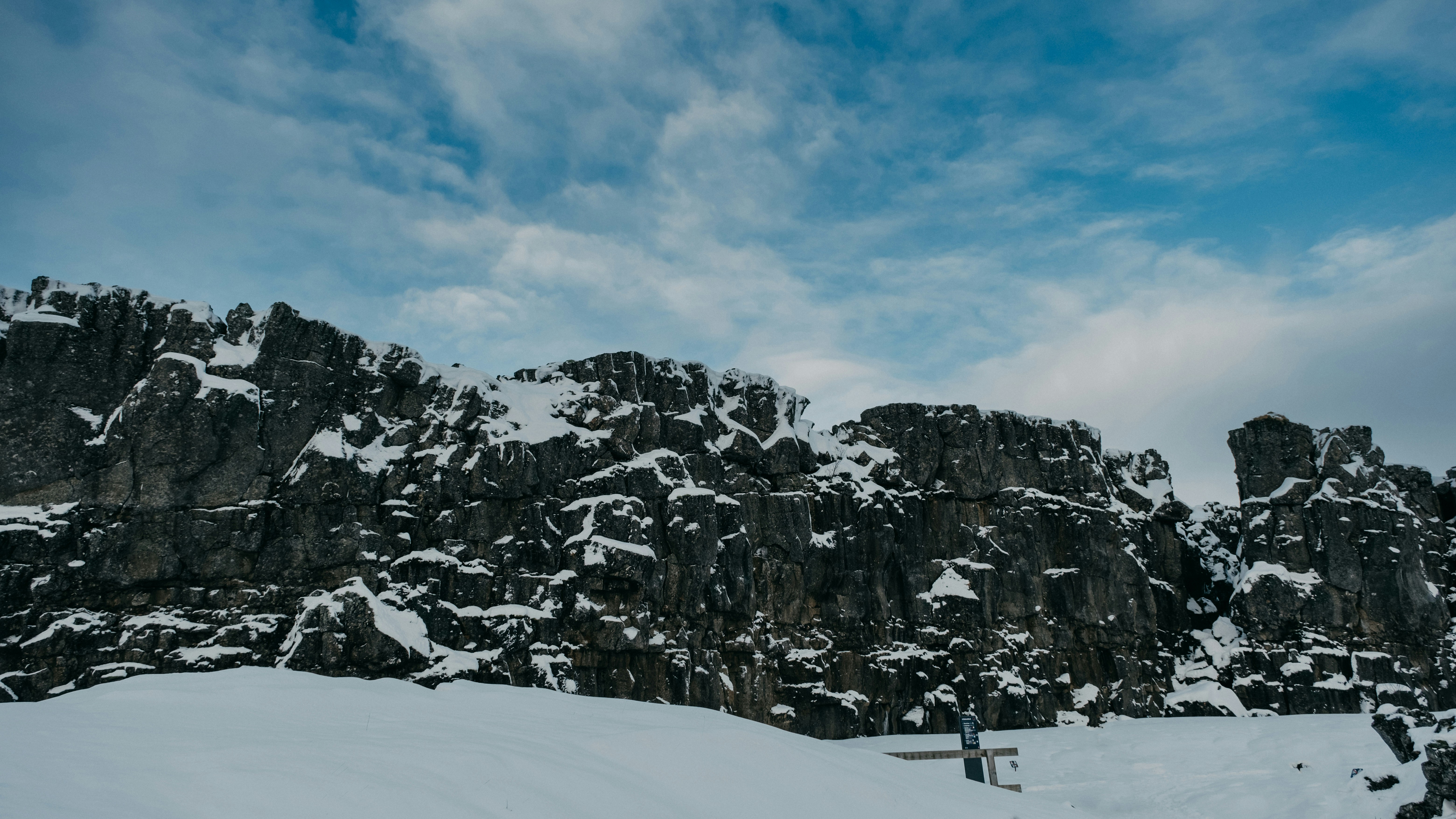 a man riding skis down a snow covered slope