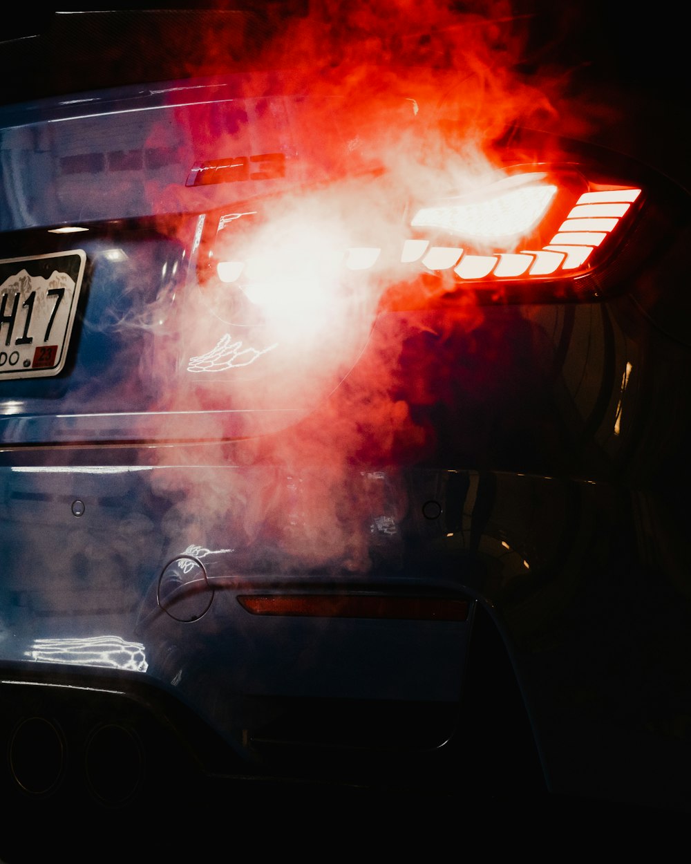 a close up of a car with smoke coming out of it
