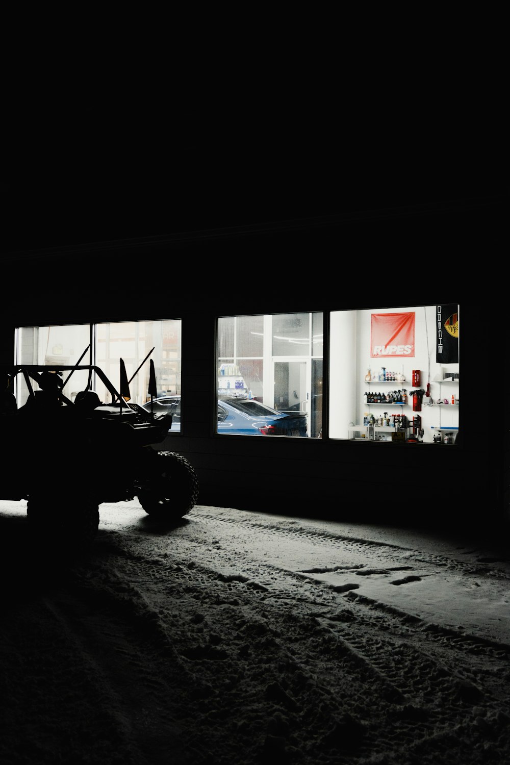 a car parked in front of a store window