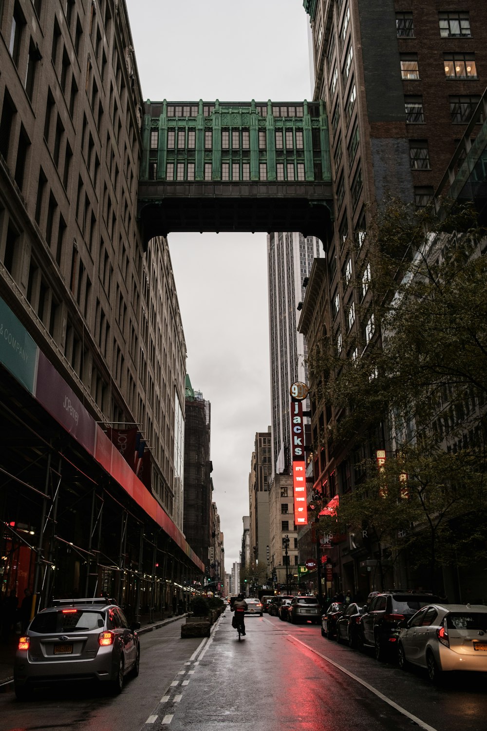 a city street with a bridge over it