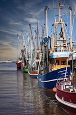 a group of boats that are sitting in the water