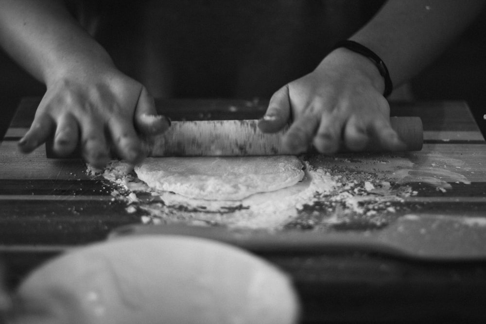 a pizza sitting on top of a cutting board