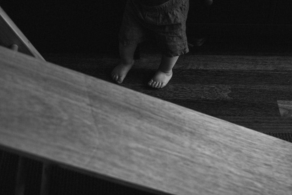 a person sitting on a wooden bench