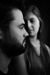 a black and white photo of a man and a woman