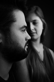 a black and white photo of a man and a woman