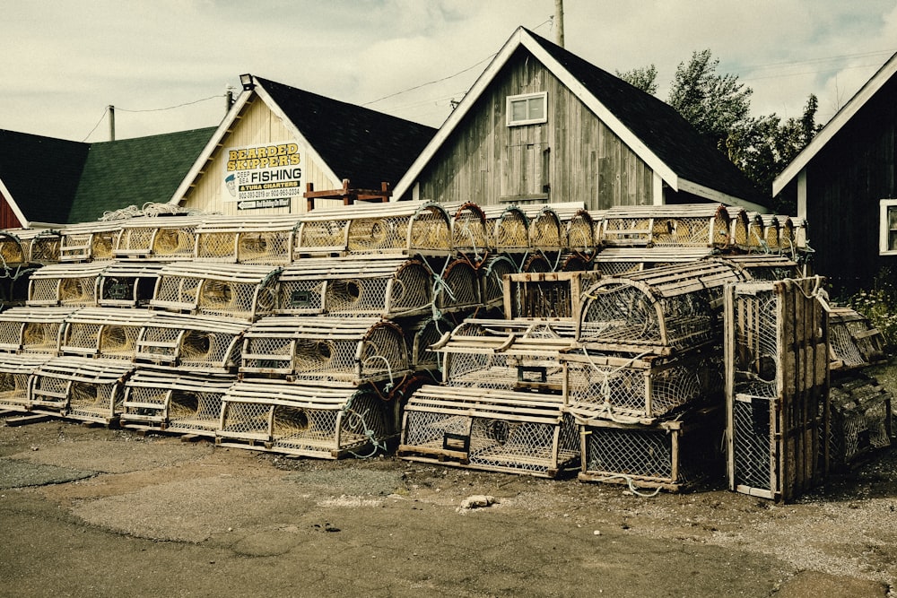 a pile of bird cages sitting in front of a building