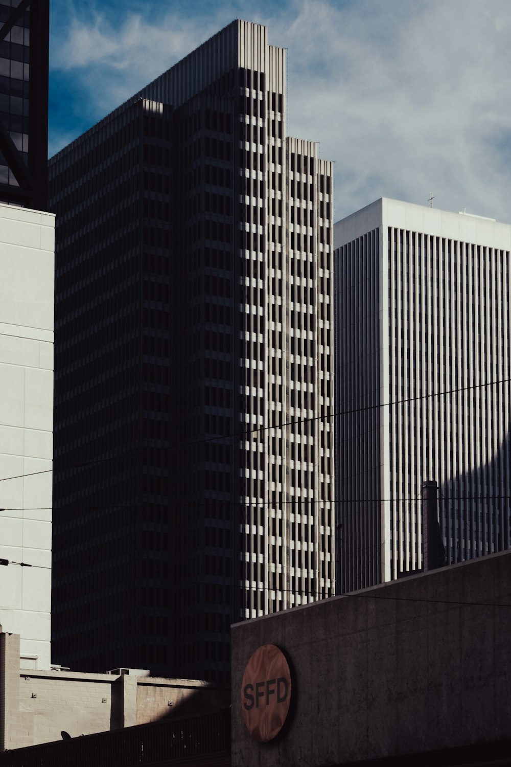 a tall building with a sign on the side of it