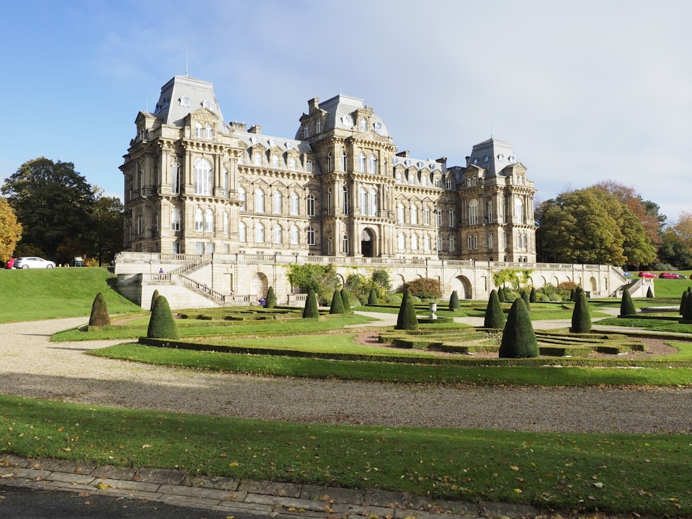 a large building with a garden in front of it