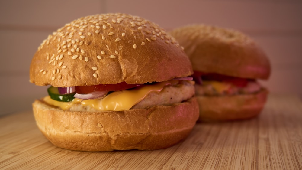 a close up of two sandwiches on a table